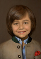 A little boy in a Bavarian jacket