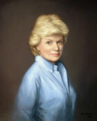 Portrait of a lady in a blue shirt