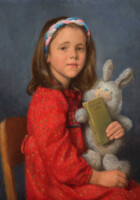 A little girl with a care-bear