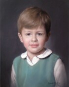 A young boy with a green jumper