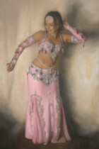 Bellydancer in pink turning to her right