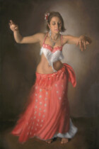 Bellydancer in red with her arms raised